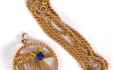 An 18ct gold and gem set pendant modelled as a bird