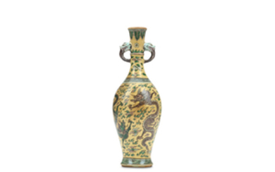 A CHINESE FAMILLE VERTE DRAGON BISCUIT VASE. Qing...