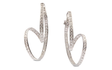 A pair of diamond earclips Each of elongated...