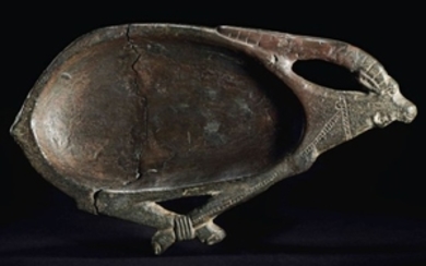 AN EGYPTIAN STEATITE PALETTE IN THE FORM OF AN IBEX, NEW KINGDOM, 1550-1070 B.C.