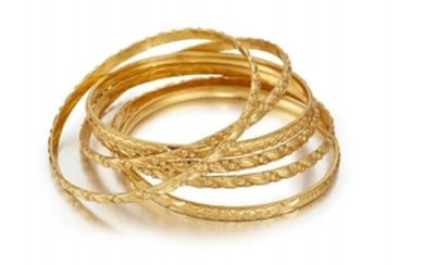 A group of six 22ct. gold bangles,...