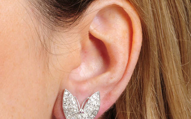 A pair of mid 20th century platinum diamond butterfly earrings.