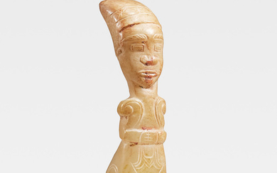 A rare calcified jade carving of a kneeling figure
