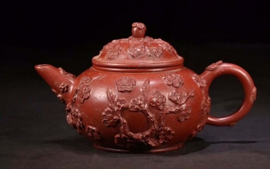 A ZISHA TEAPOT DECORATED WITH FLOWERS