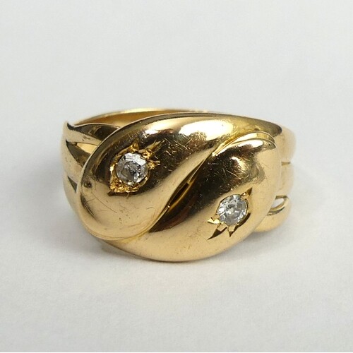 18 carat gold diamond set snake design ring, 7.3 grams. Size...