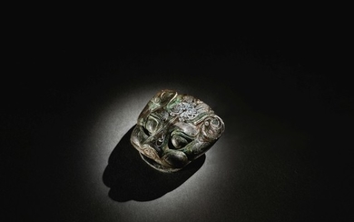 A RARE SILVER-INLAID BRONZE 'BEAST HEAD' CHARIOT ORNAMENT WARRING STATES PERIOD - HAN DYNASTY