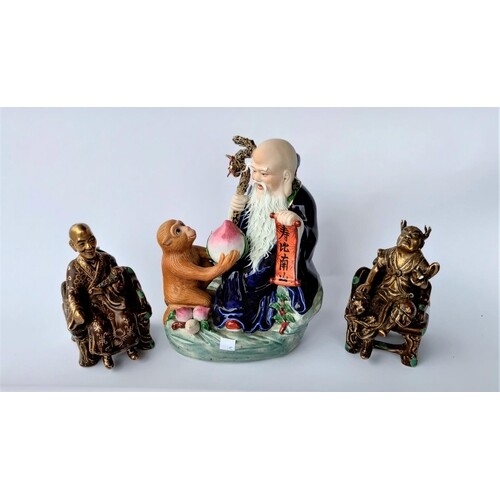 3 Chinese porcelain figures: one of a monkey giving fruit to...