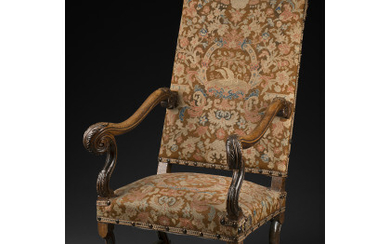 17th-century walnut armchair covered in needlepoint fabric