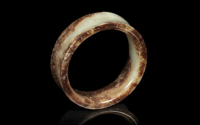 A yellow and russet jade bangle