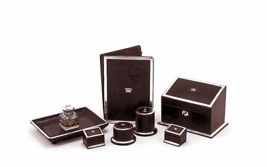A Victorian seven-piece silver mounted leather desk set