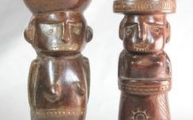 Tribal art: Trobriand Islands, Papua New Guinea, two carved figures, one carrying an open bowl on her head, 27.5cm. Provenance:...