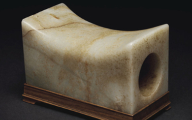 A MOTTLED PALE GREENISH-WHITE AND RUSSET JADE RECTANGULAR PILLOW, CHINA, MING DYNASTY (1368-1644) OR LATER