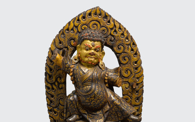 A polychrome gilt lacquered wood figure of Dorje Drolo