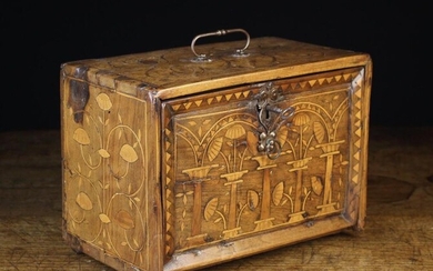 A 17th Century Marquetry Table Cabinet with enclosed drawers. The rectangular fall front box inlaid