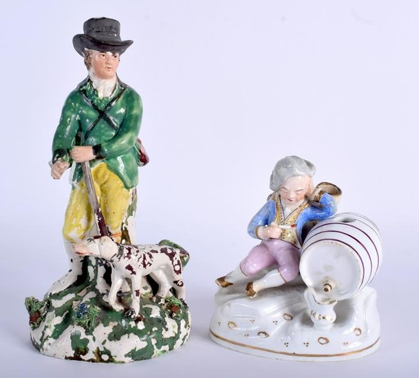 A 19TH CENTURY STAFFORDSHIRE FIGURE OF A MALE together