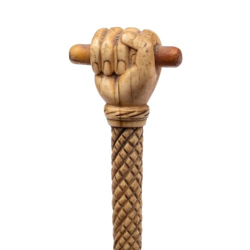 A 19th century marine ivory walking cane with carved pommel ...