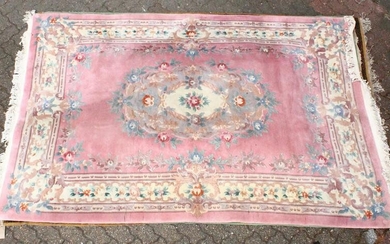 A 20TH CENTURY CHINESE CARPET, pink ground with floral
