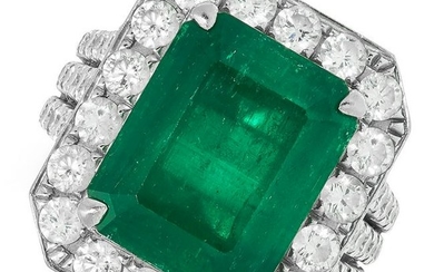 A 7.69 CARAT COLOMBIAN EMERALD AND DIAMOND RING set