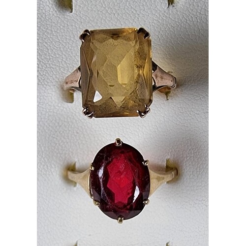 A 9ct gold and citrine dress ring and a 9ct gold paste ring,...