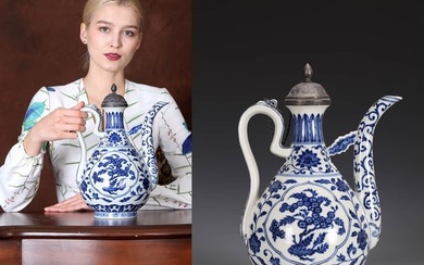 A BLUE AND WHITE FLOWER AND FRUIT EWER