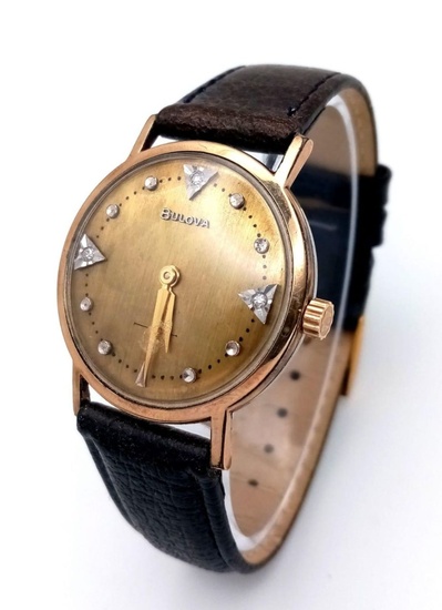 A BULOVA MID SIZE GOLD PLATED MANUAL WIND...