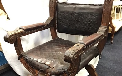 A C19th Italian Renaissance style oak armchair with foliate leather...
