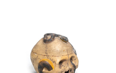 A CERAMIC OKIMONO (TABLE ORNAMENT) OF A SKULL AND SNAKE...