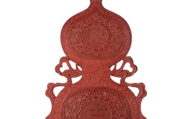 A CHINESE CARVED CINNABAR LACQUER DOUBLE GOURDS PANEL