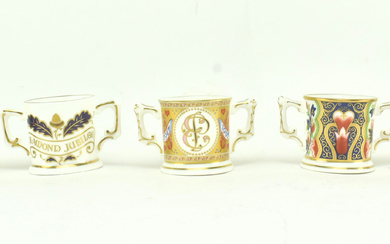 A COLLECTION OF ROYAL CROWN DERBY MINIATURE LOVING CUPS