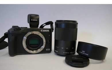 A Canon EOS M6 With Canon 55-200mm Image Stabilizer Zoom Len...