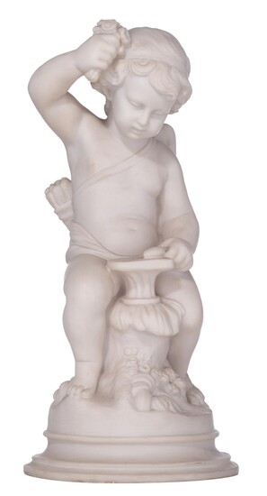 A Carrara marble figure of Cupid forging the arrow of love, H 49,5 cm