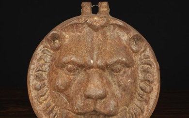 A Cast Iron Lion Mask with a hinge mount to the top, 10½'' x 9¾'' (27 cm x 25 cm).