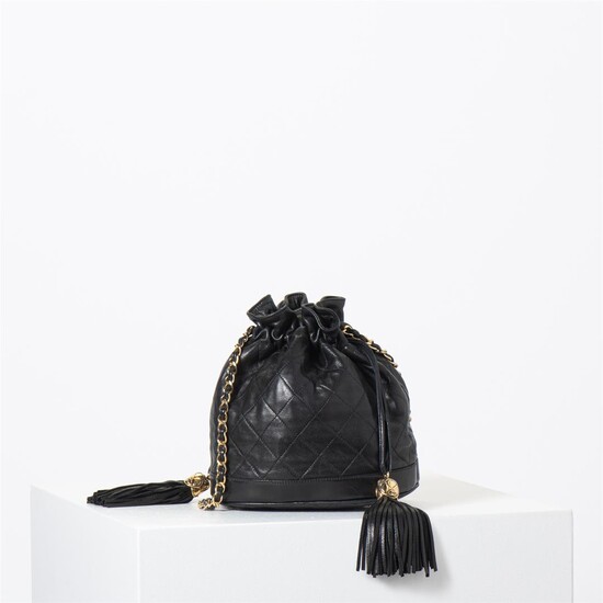 (-), A Chanel Black Lambskin Leather Bucket Bag...