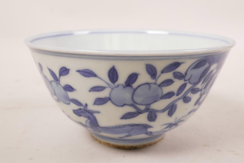 A Chinese blue and white porcelain rice bowl decorated with ...