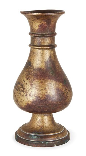 A Chinese bronze pear-shaped vase, yuhuchunping, 17th/18th century, cast with a bulbous, pear-shaped body and two collar bands encircling the slim neck, all resting on a spreading stepped foot, 18.7cm high