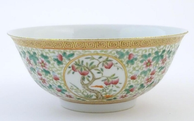 A Chinese famille verte bowl decorated with fruiting