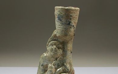 A Chinese green-glazed figural lamp, probably Han