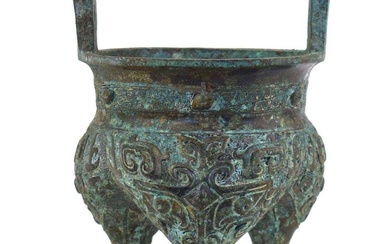 A Chinese green patinated bronze incense burner of archaic form,...