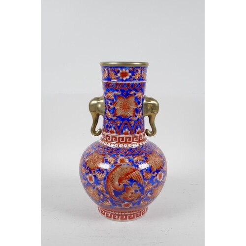 A Chinese porcelain two handled vase with red and blue phoen...