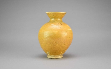 A Chinese porcelaneous ochre glazed jar, probably Tang Dynasty