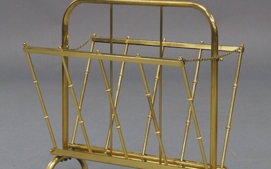 A French brass folding magazine rack, circa 1960, with folding sides on curved supports, 43cm high, 44cm wide, 26cm deep