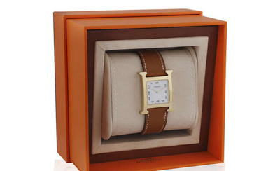 A GOLD PLATED 'HEURE H' WRISTWATCH, BY HERMÈS,...