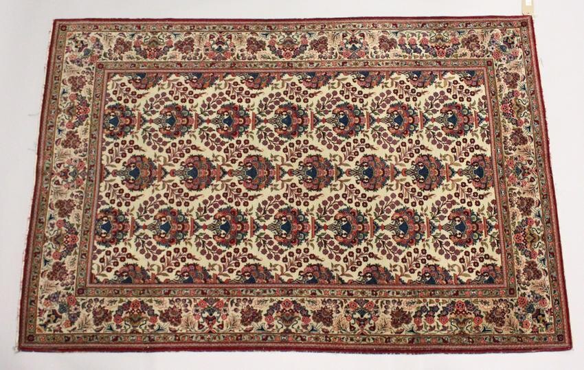 A GOOD PERSIAN KAHAN CARPET, cream ground with vases of