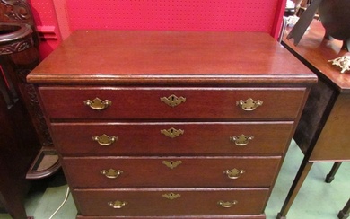 A George II oak caddy top chest of four graduating long draw...