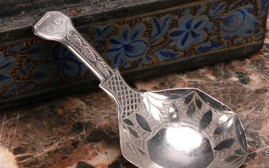 A George III silver caddy spoon, octagonal bowl, bright-cut ...