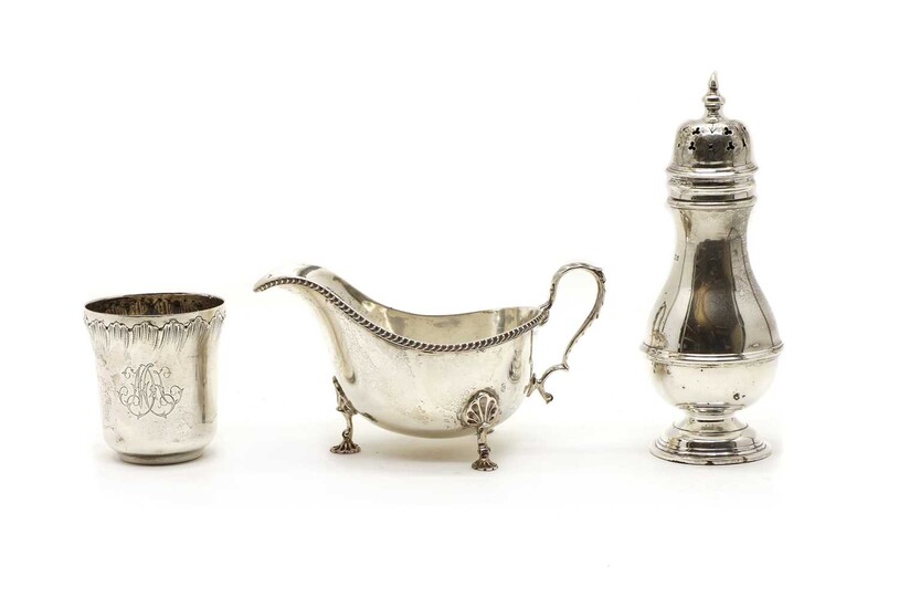 A George III style silver sauce boat, a sugar castor and a beaker