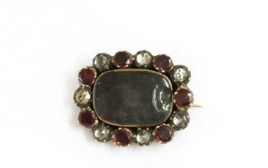 A Georgian gold and silver, garnet and paste memorial brooch