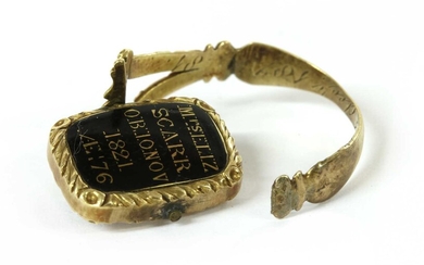 A Georgian gold enamel memorial swivel ring