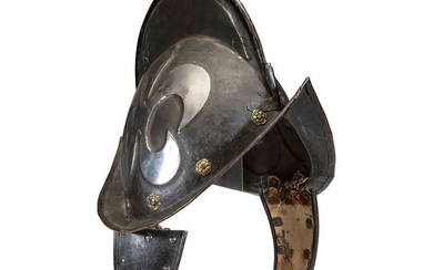 A German Black and White Comb Morian Helmet with Ear Flaps