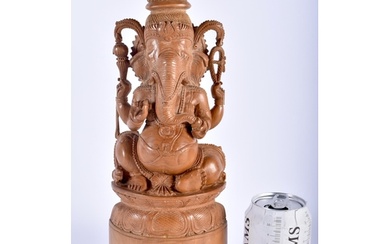 A LATE 19TH CENTURY INDIAN CARVED SANDALWOOD FIGURE OF GANES...